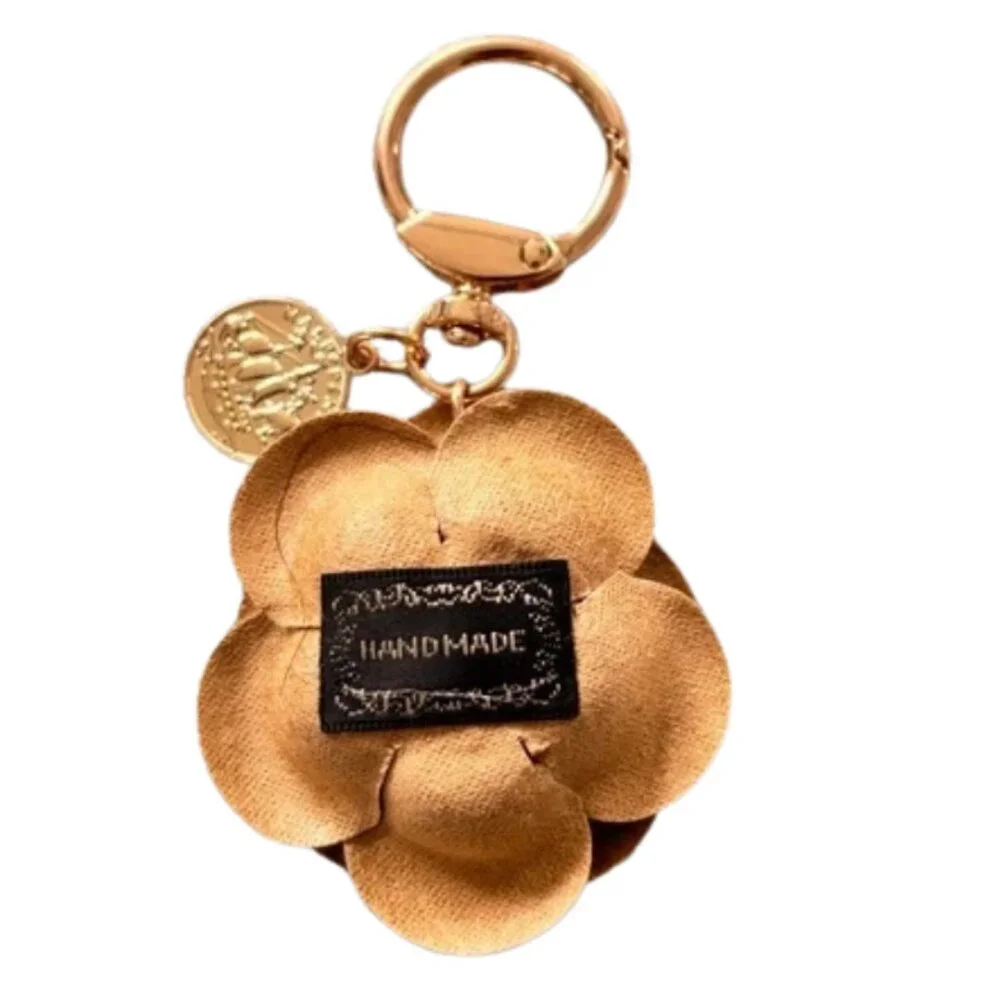 Handmade Gold Flower Keychain - Picture 2 of 3